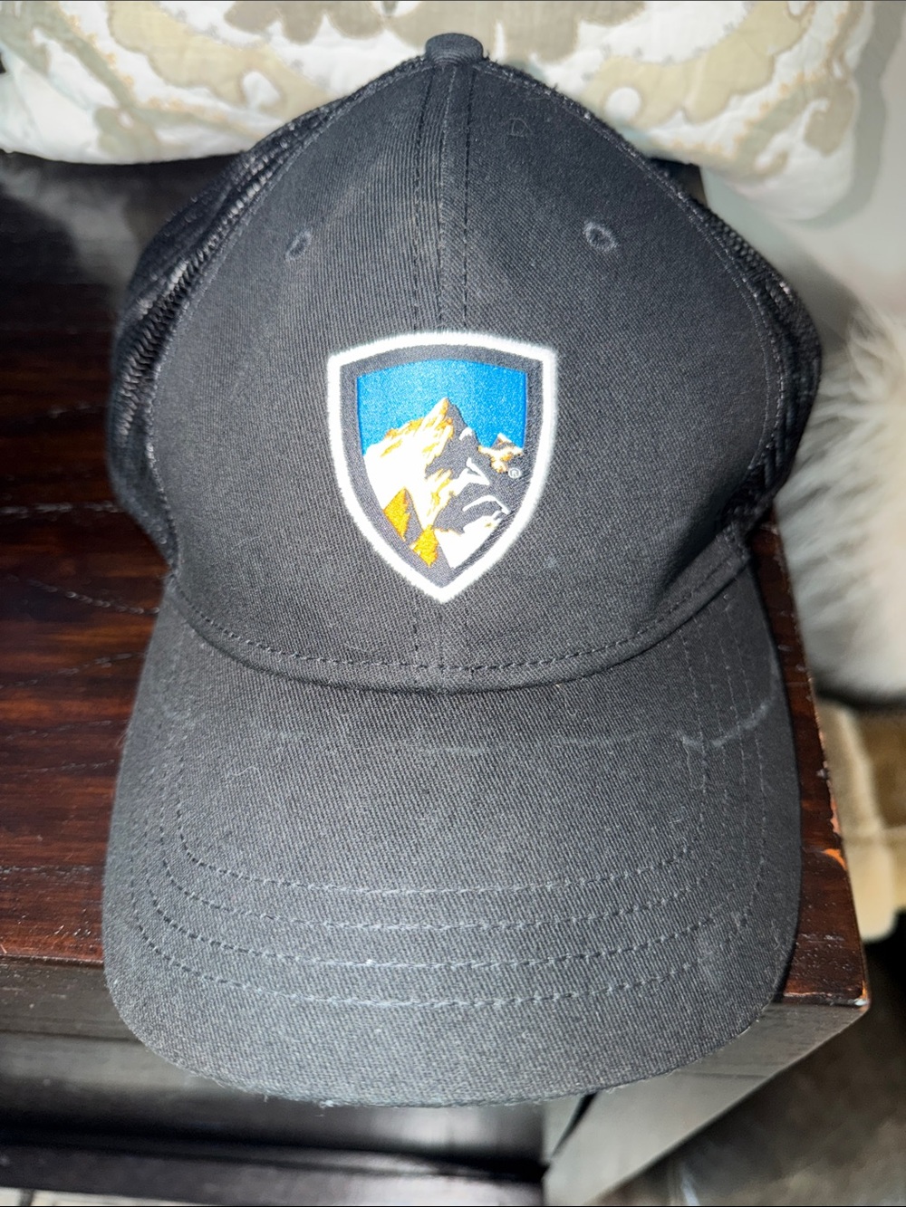 Kuhl Black Trucker Hat with Mountain Shield Patch